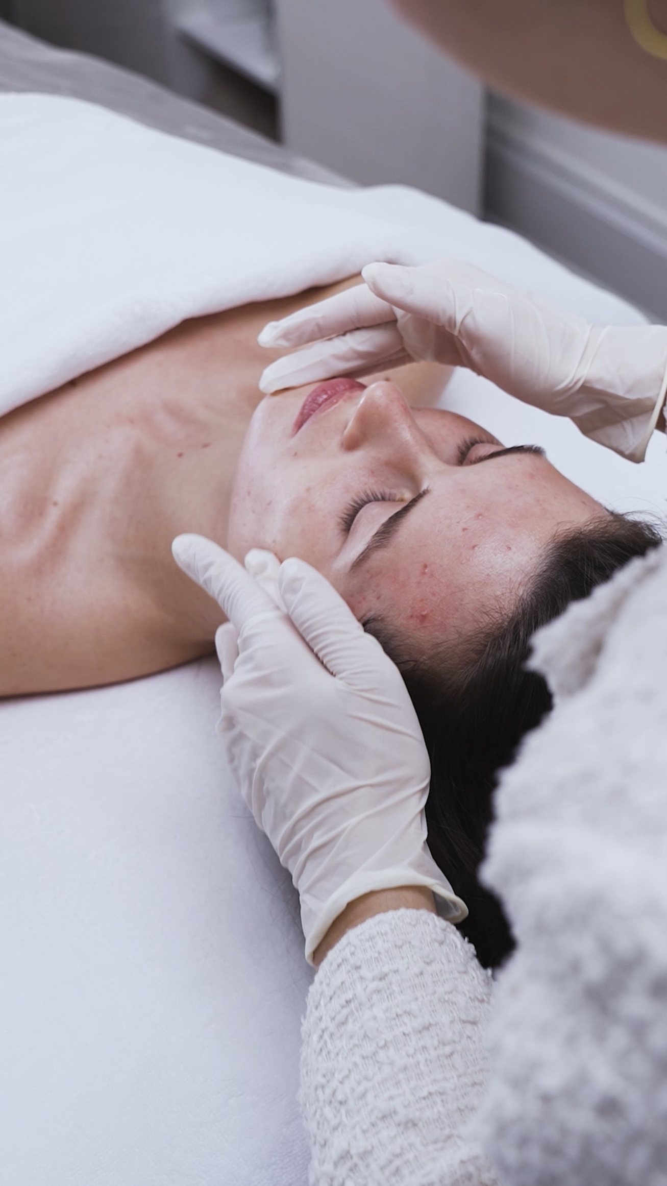 Professional facial treatment at CP Praxis Basel – cosmetician performing a luxury skin care ritual on a client