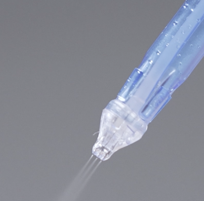 JetPeel device spraying serum during a needle-free facial in Basel